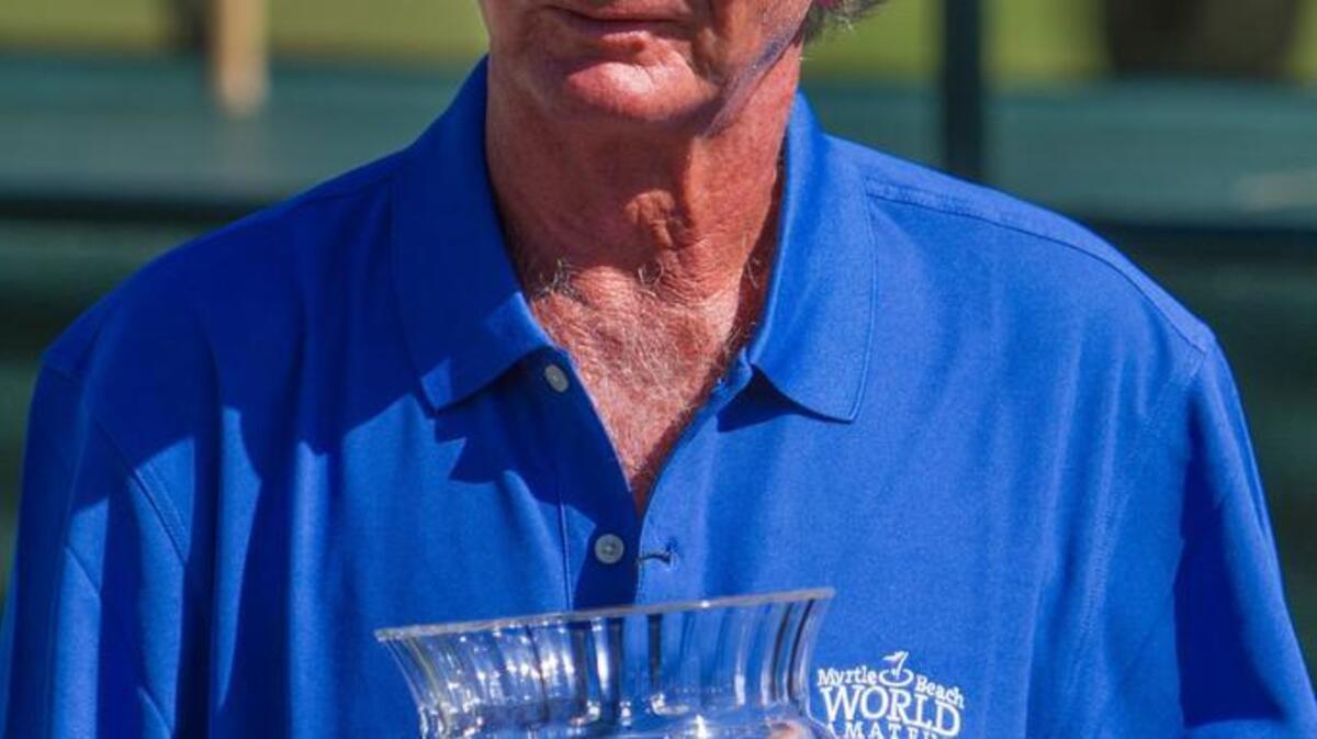 
Dennis Rasku of Pompano Beach, Fla., holds the Championship Trophy at the 31st annual Myrtle Beach World Amateur Handicap Championship at Barefoot Resort’s Dye Club Friday.
