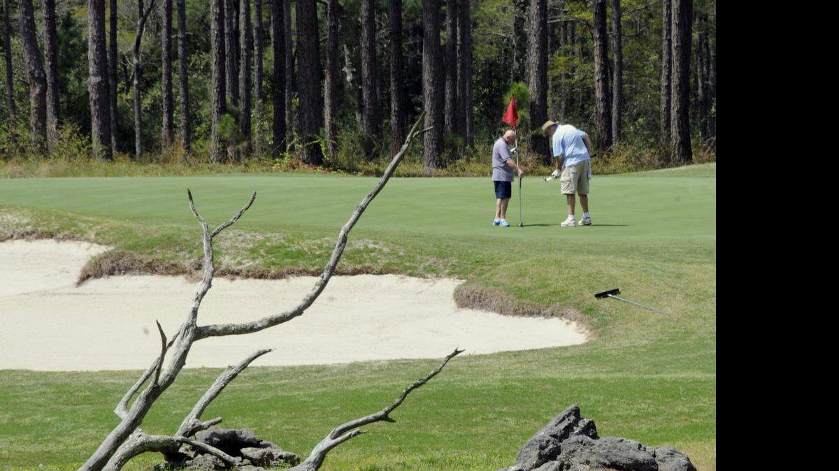 
The par-3, 147-yard 13th at The Pearl Golf Links is guarded by a large bunker along the front.
