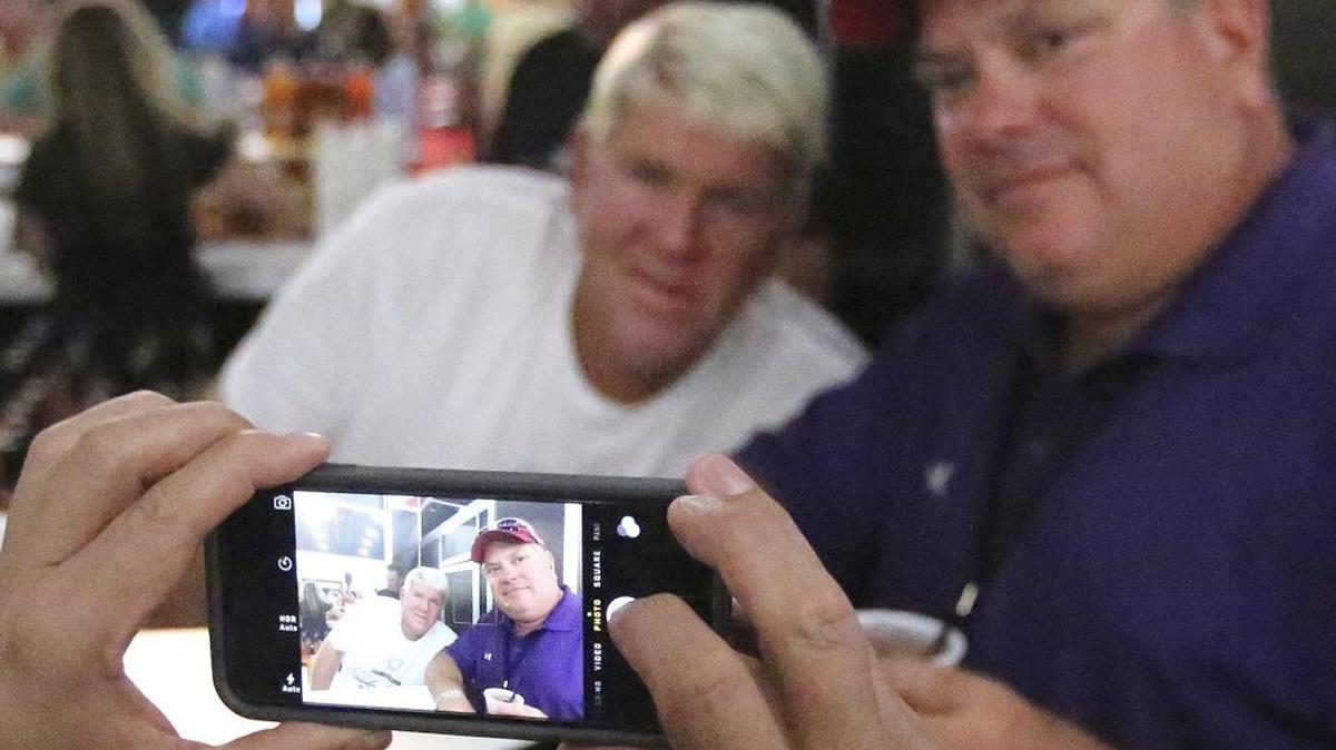 
Two-time major champion John Daly promotes his signature drinks, poses for photographs and signs autographs at the Myrtle Beach World Amateur Handicap Championship World’s Largest 19th Hole at the Myrtle Beach Convention Center on Tuesday.
