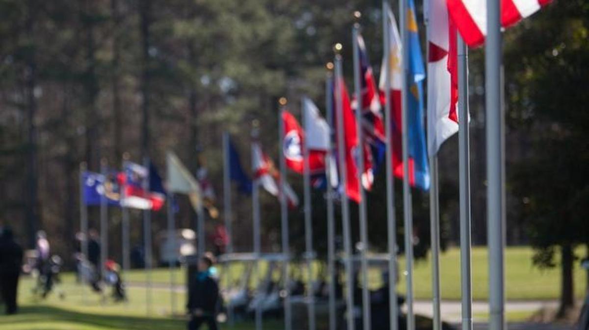 International flags fly along the practice range at TPC Myrtle Beach during the inaugural Dustin Johnson World Junior Golf Championship in February 2016.