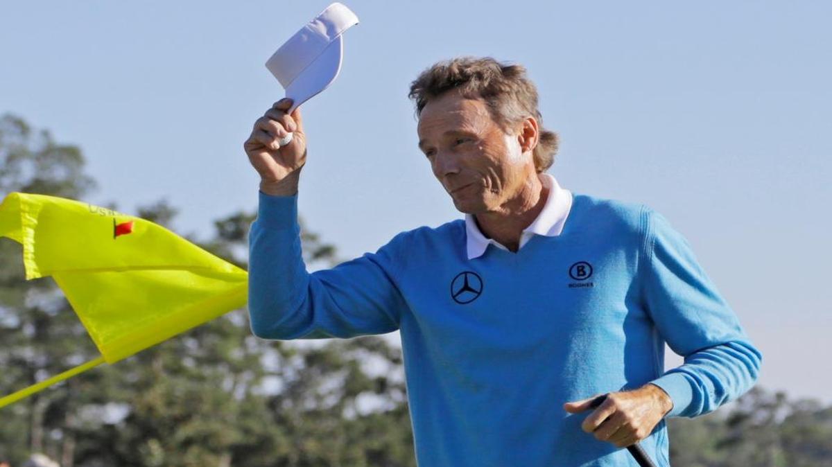 Bernhard Langer, of Germany, tips his cap after putting out on the 18th hole during the third round of the Masters.