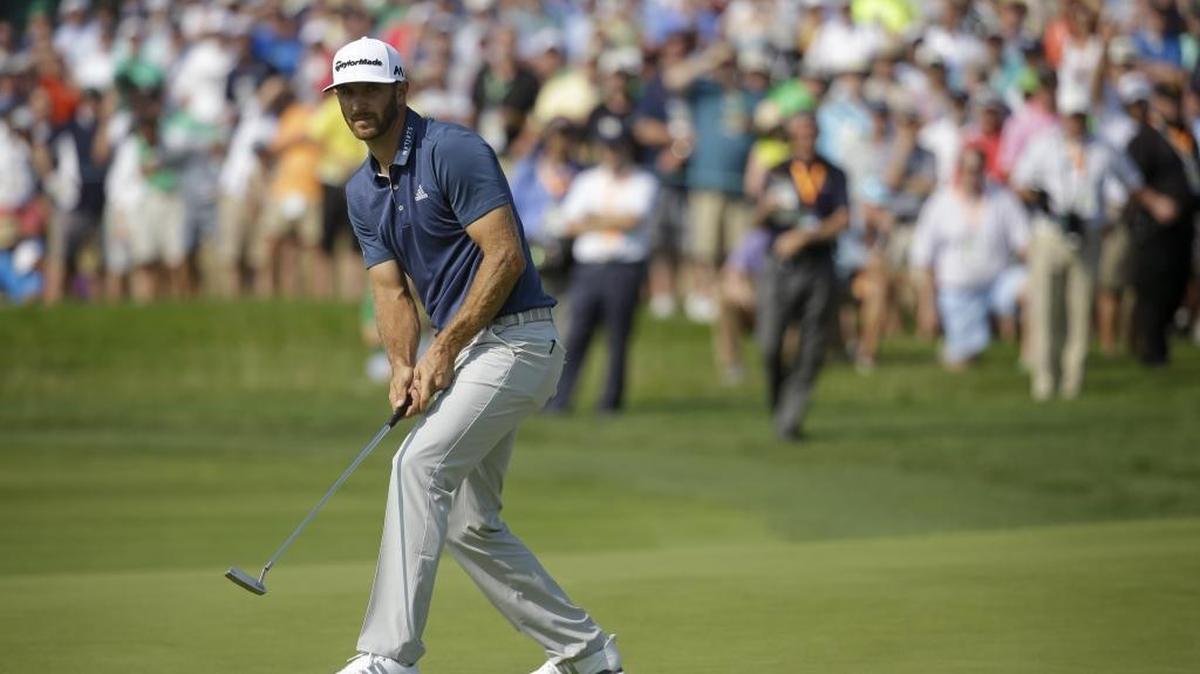Dustin Johnson watches his putt on the seventh hole during the final round of the U.S. Open.