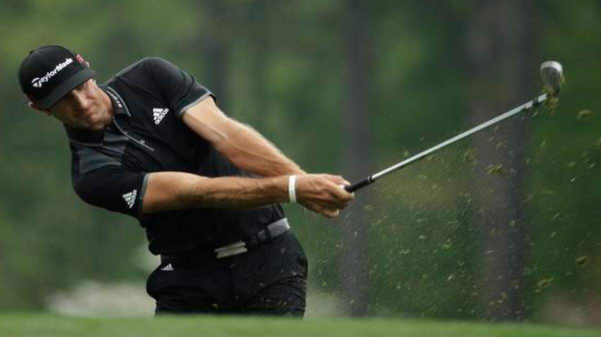 
Dustin Johnson hits on the 12th fairway during Tuesday’s practice round for the Masters in Augusta, Ga.

