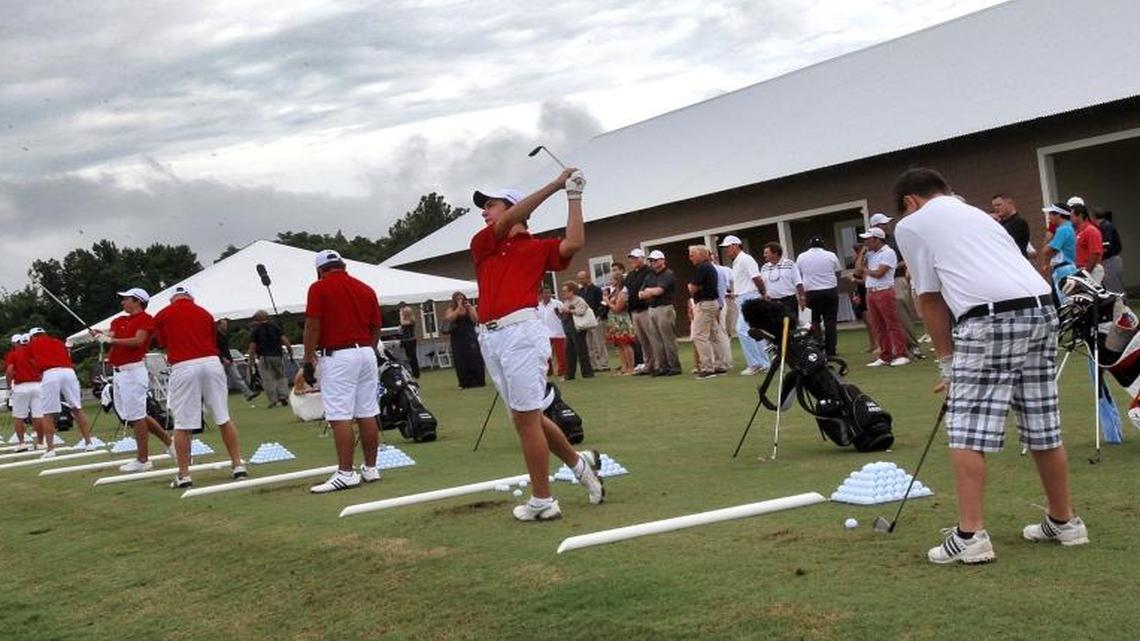 Players hit shots at the Greg Norman Champions Golf Academy at Barefoot Golf Resort’s driving range.