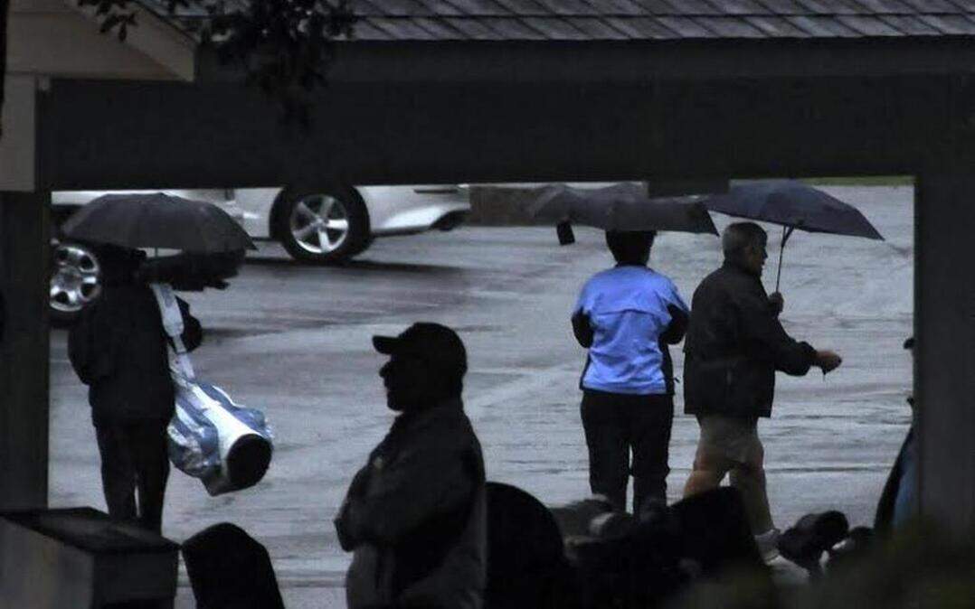 Golfers leave the course at Blackmoor Golf Club on Monday after the World Am golf flight scheduled for there was canceled because of rain.