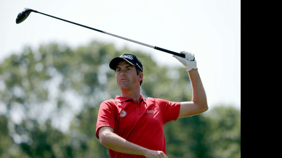 
Webb Simpson watches his tee shot on the fourth hole during the first round of the Wells Fargo Championship.
