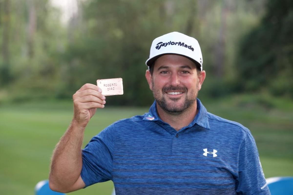 Roberto Diaz poses for a photo with his tour card in August 2017 after the final round of the WinCo Foods Portland Open at Pumpkin Ridge Golf Club in North Plains, Ore. (Photo by Steve Dykes/Getty Images)