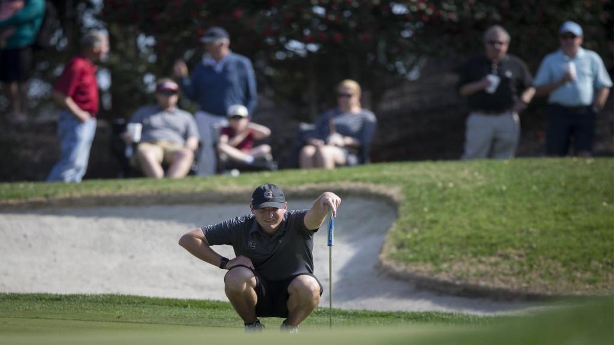 South Carolina's Matthew NeSmith checks the line of his putt on the 18th green during the final round of Coastal Carolina's General Hackler Championship at The Dunes Golf and Beach Club in Myrtle Beach on Sunday.