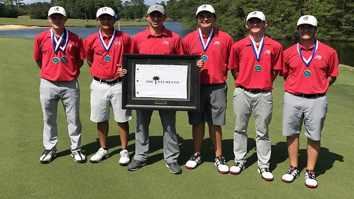 The Waccamaw boys golf team poses with a plaque after winning the Palmetto High School Golf Championship.