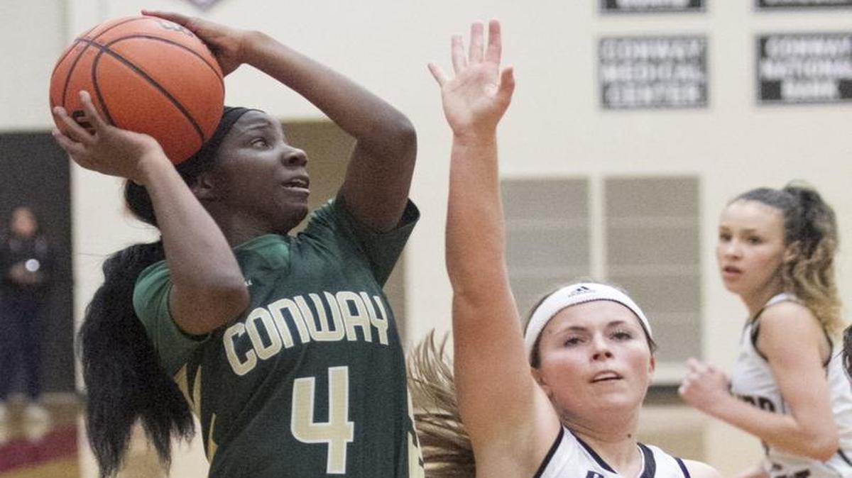 Conway’s MeMe Williams takes goes up for a shot over a Carolina Forest defender Friday.