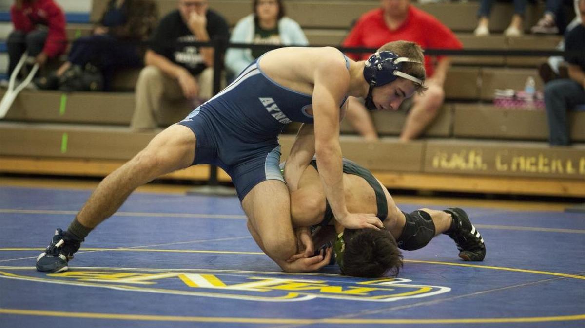 Aynor’s Seth Sarvis (left) takes down Conway’s Tompkins Monroe during the 2017 Horry-Georgetown Wrestling Championships earlier this year.