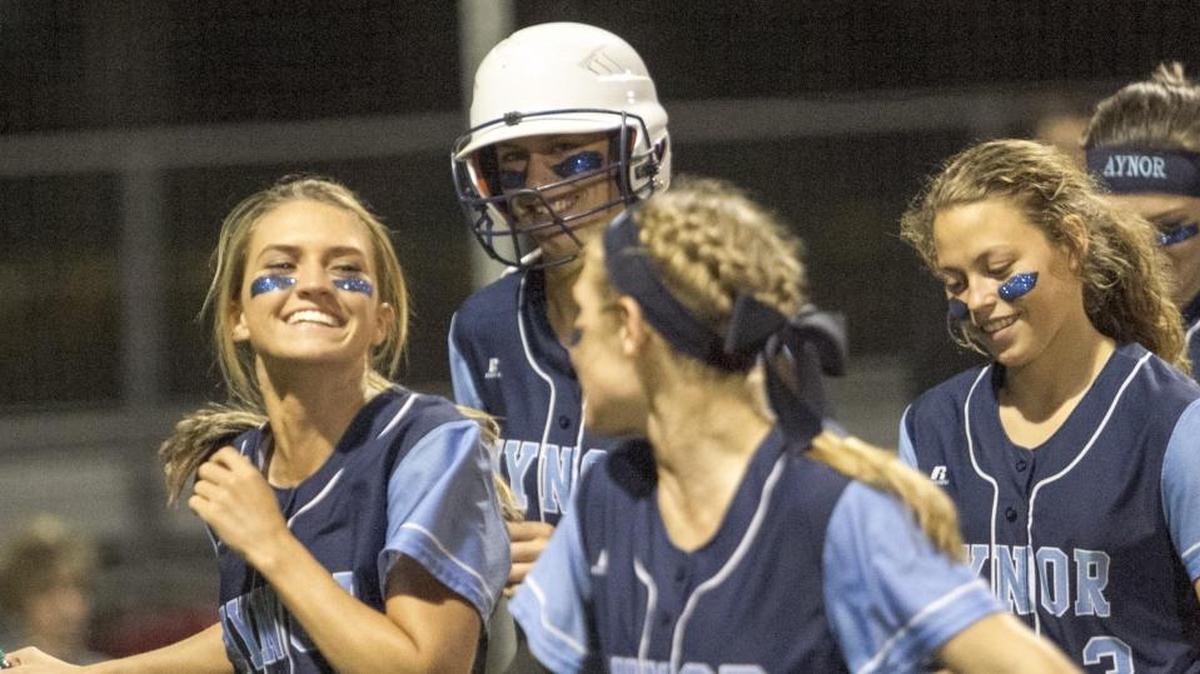 Aynor softball players celebrate with teammate Layna Johnson after she hit a home run earlier this season.