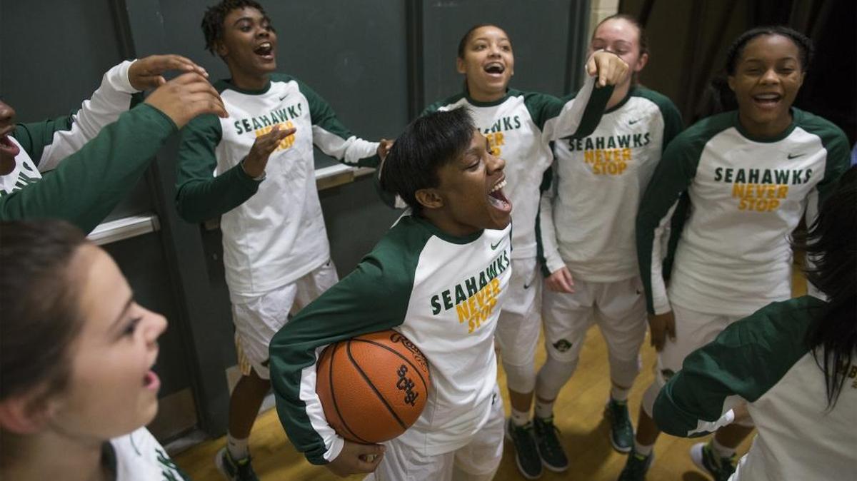 Myrtle Beach guard Keocia Walker (center) leads the Seahawks in warmups before a playoff game against Crestwood. The Seahawks will head to Columbia on Friday for Saturday’s Class AAA state championship game against Dreher.