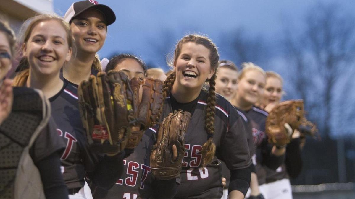 Carolina Forest players joke as starters are announced during a agme earlier this season.