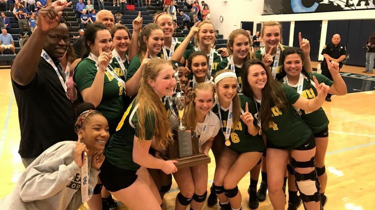 The Myrtle Beach High volleyball team celebrates winning the Class 4A state title Saturday.