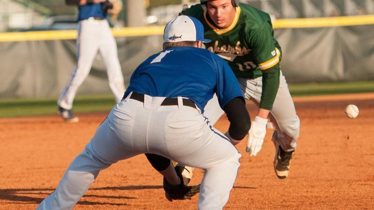 Jackson Thomas dives for third base Anthony Peck as a St. James third baseman waits for the relay during a game earlier this season. Both teams begin their respective playoff quests Friday.