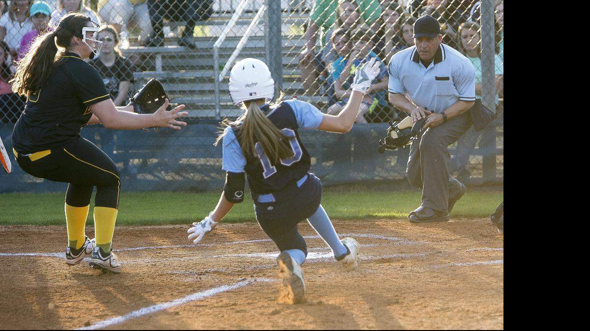 
Aynor’s Jessie Johnson slides into home on a passed ball Tuesday night against Dillion. 
