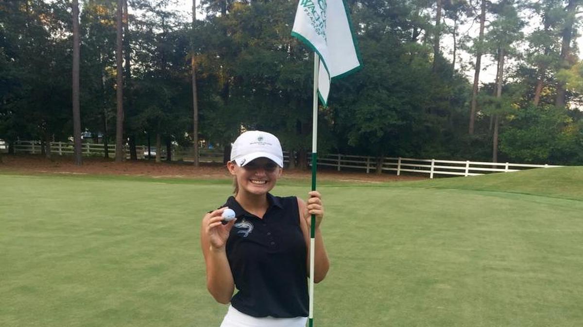 St. James’ Jordan White celebrates her hole-in-one at Wachesaw Plantation Club last week.