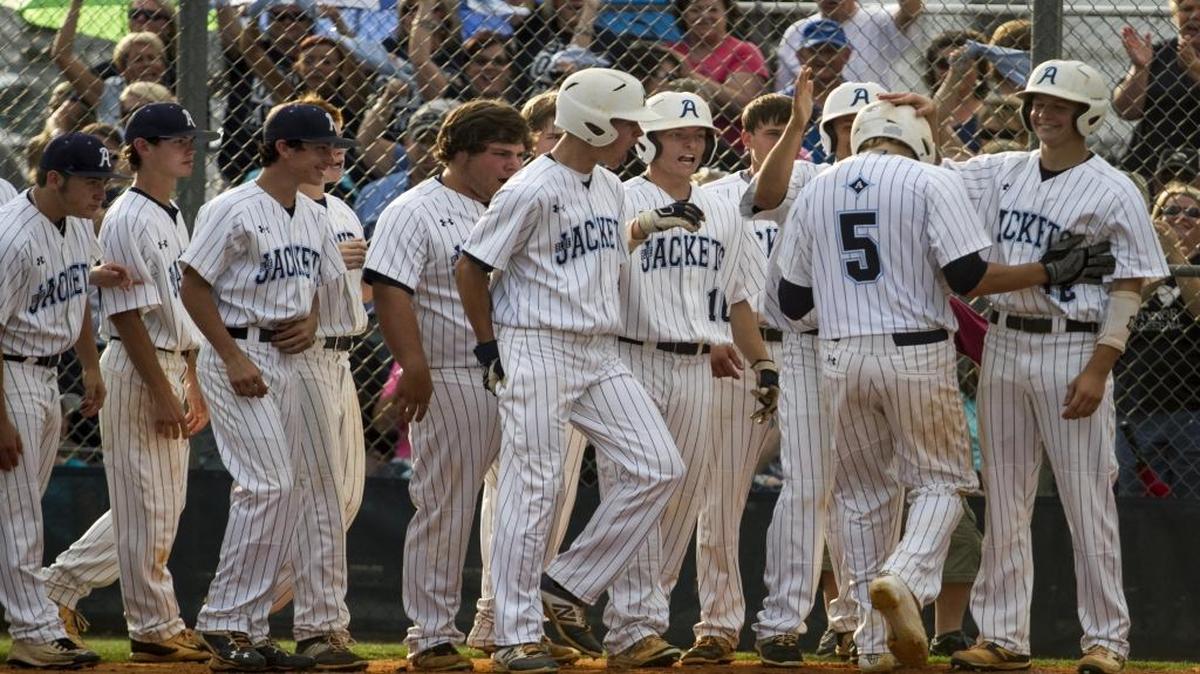 Aynor’s Ian Prosser celebrates with teammates after hitting a three-run homer against Bishop England. The Blue Jackets finished No. 1 in Class AA after winning a state title in the classification.