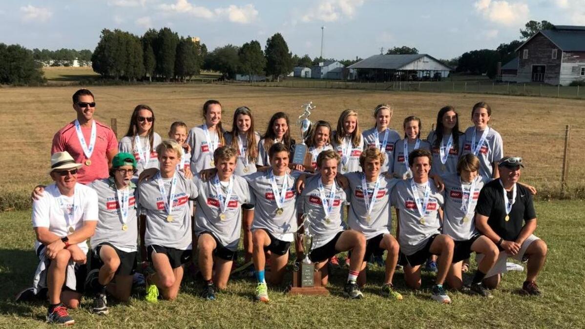 The Waccamaw boys and girls cross country teams pose for a photo after sweeping the Class 3A state titles Saturday.