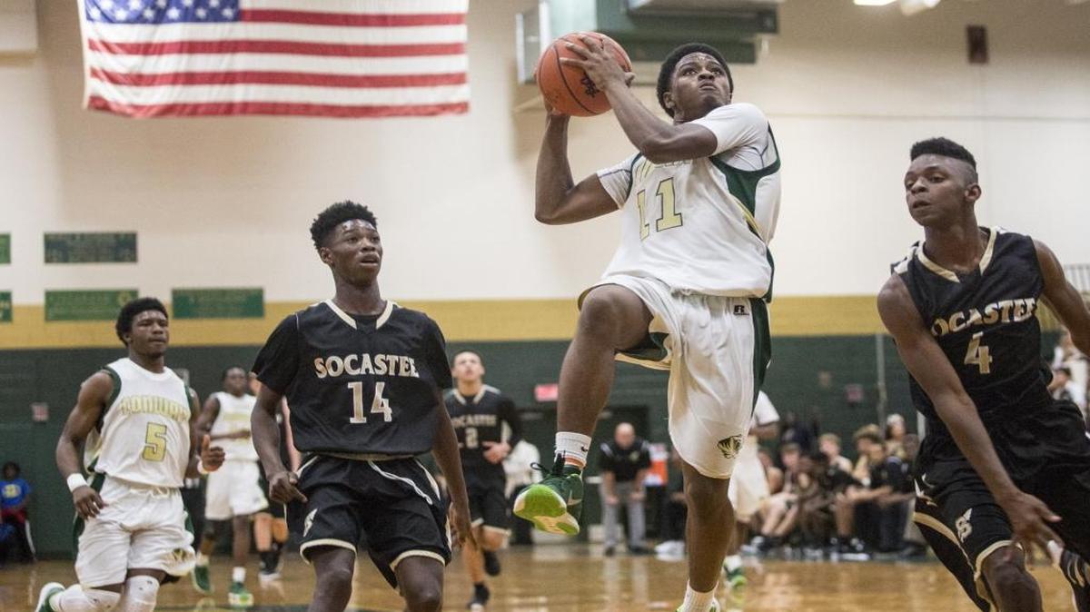 Conway’s Darren Stanley (11) goes up for a shot during Tuesday night’s game against Socastee.