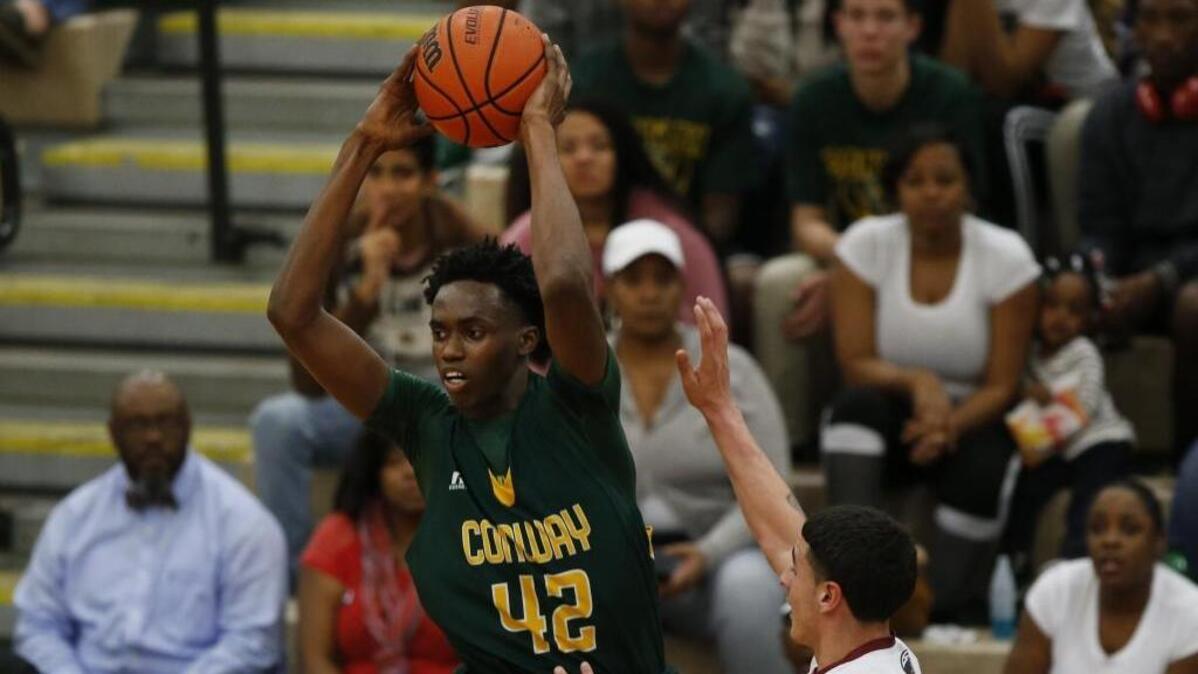 Conway forward Jimmy Nichols (42) looks to pass after a rebound against Carolina Forest during a game last season.