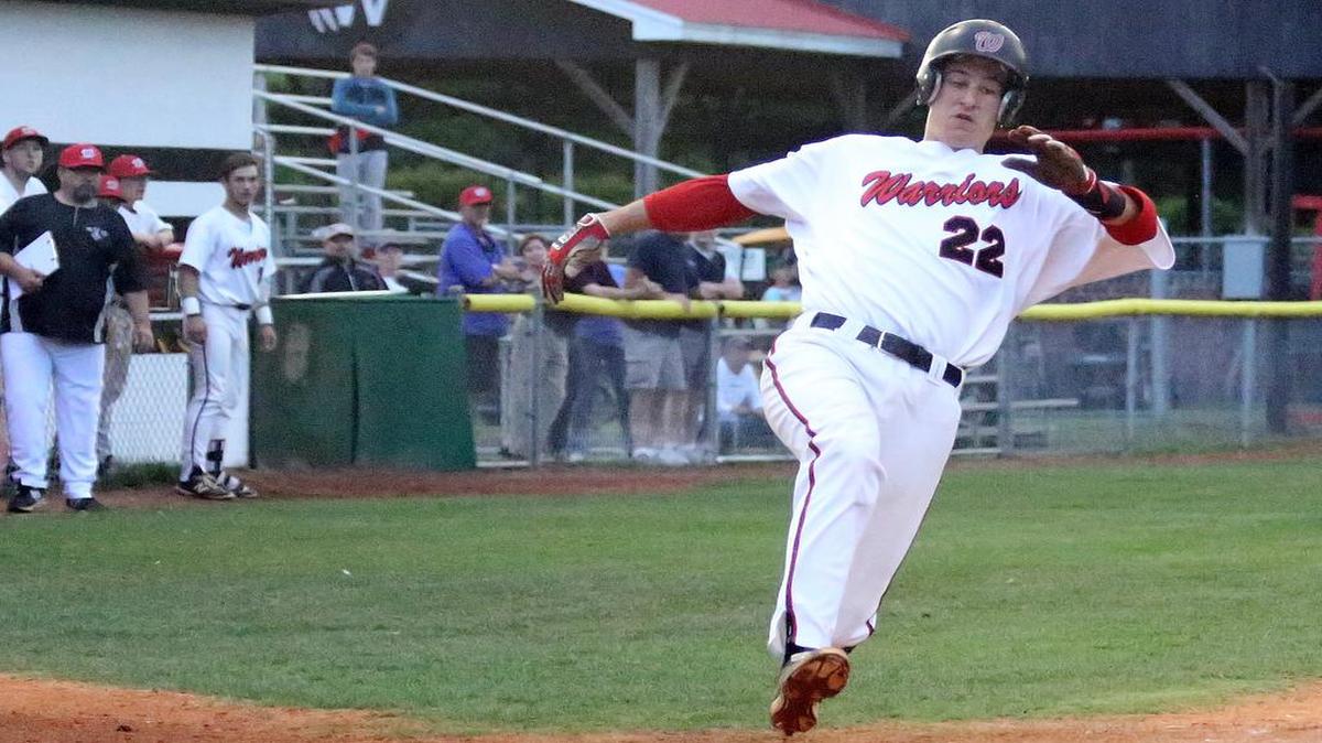 Waccamaw’s Levi Almond slides home in the Warriors’ game with Andrews last week.
