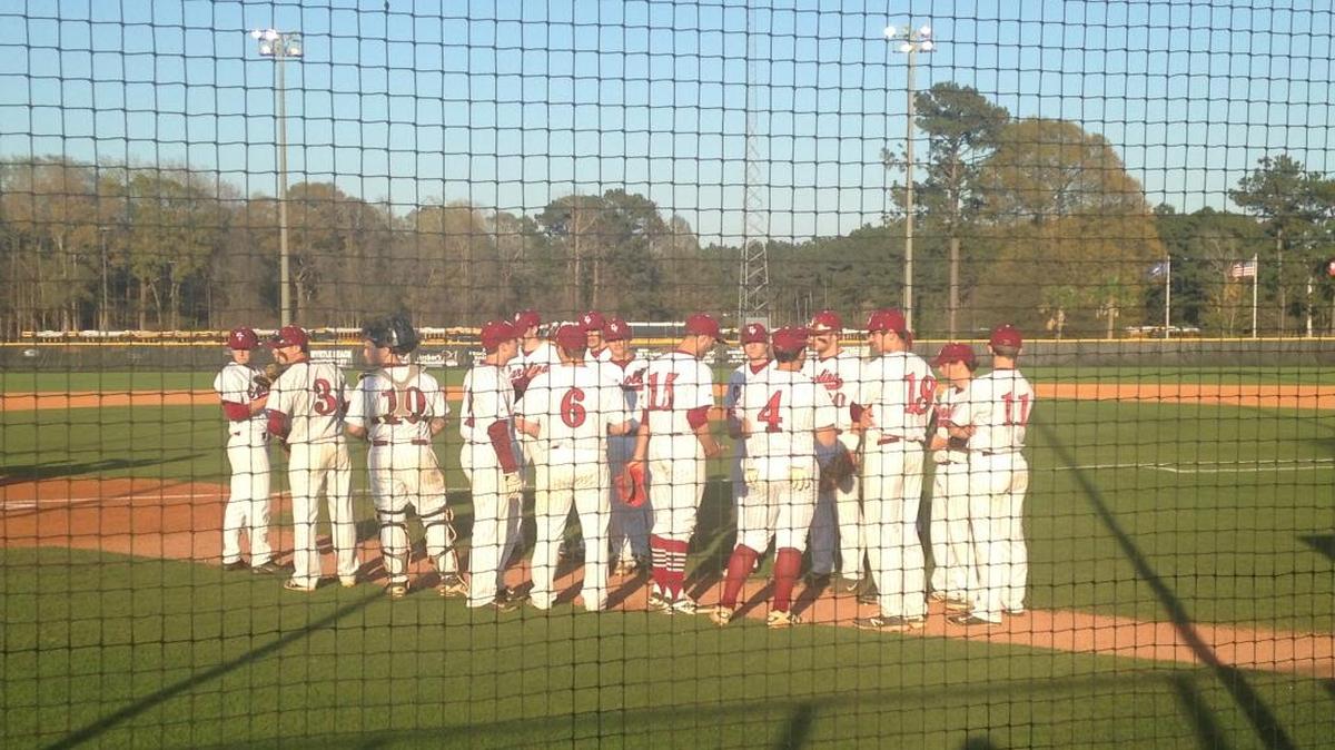 The Carolina Forest baseball team huddles prior to Tuesday night’s game against South Florence.
