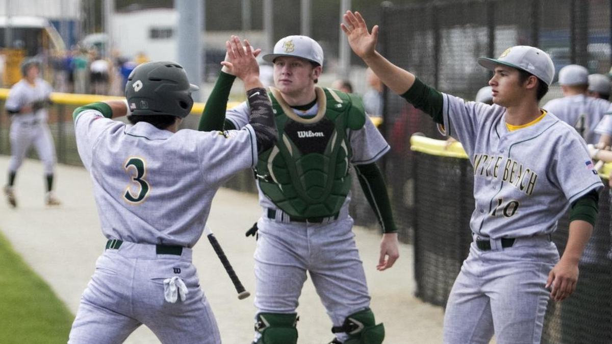 Myrtle Beach’s Luke Edwards is congratulated by teammates after scoring a run during a recent game.