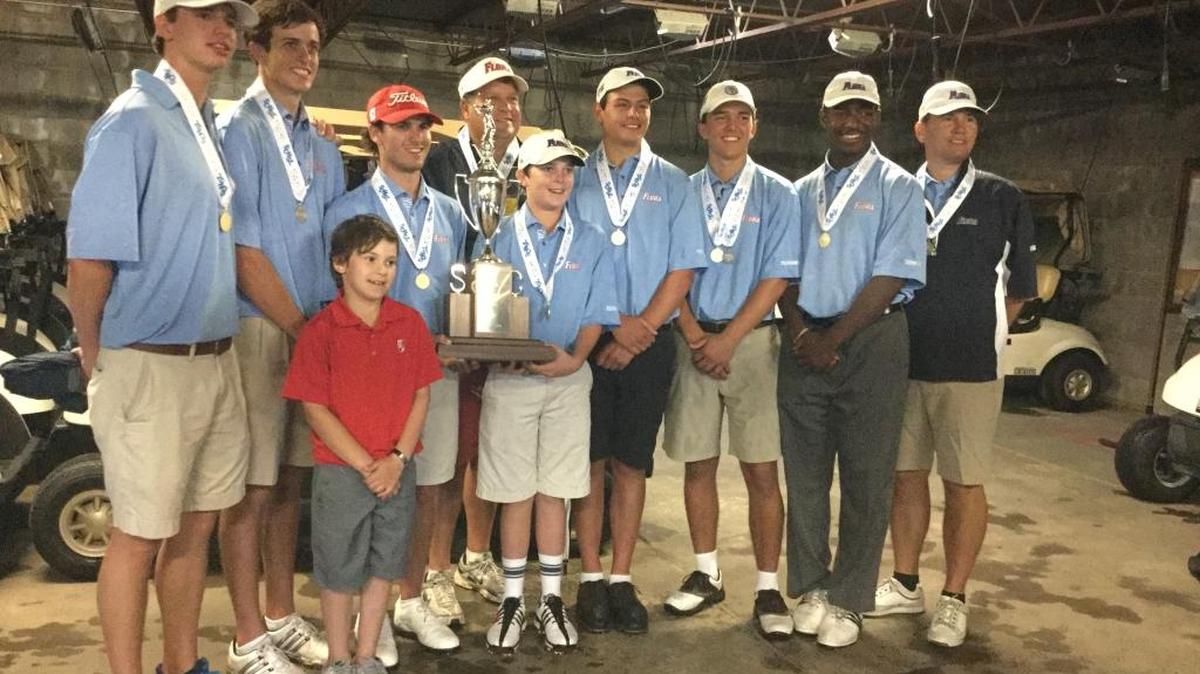 A.C. Flora players pose with the trophy after winning the Class AAA state championship Tuesday.