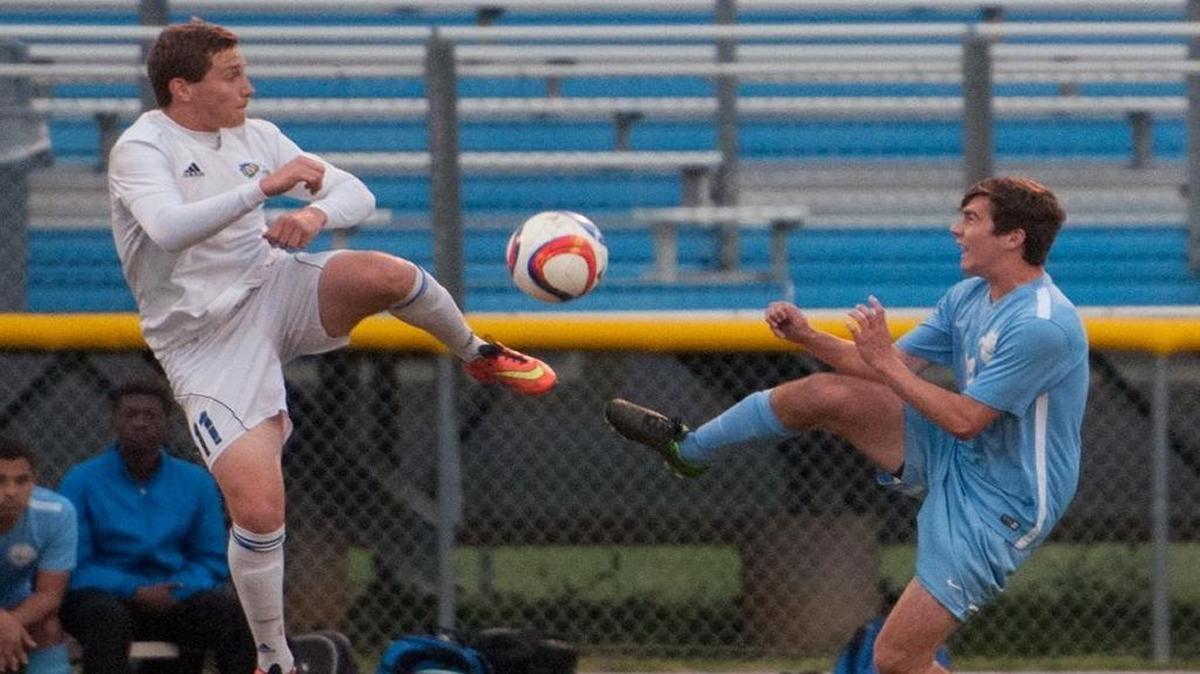 North Myrtle Beach’s Simon Sander battles St. James’ Christopher Young for the ball during Tuesday’s soccer match.
