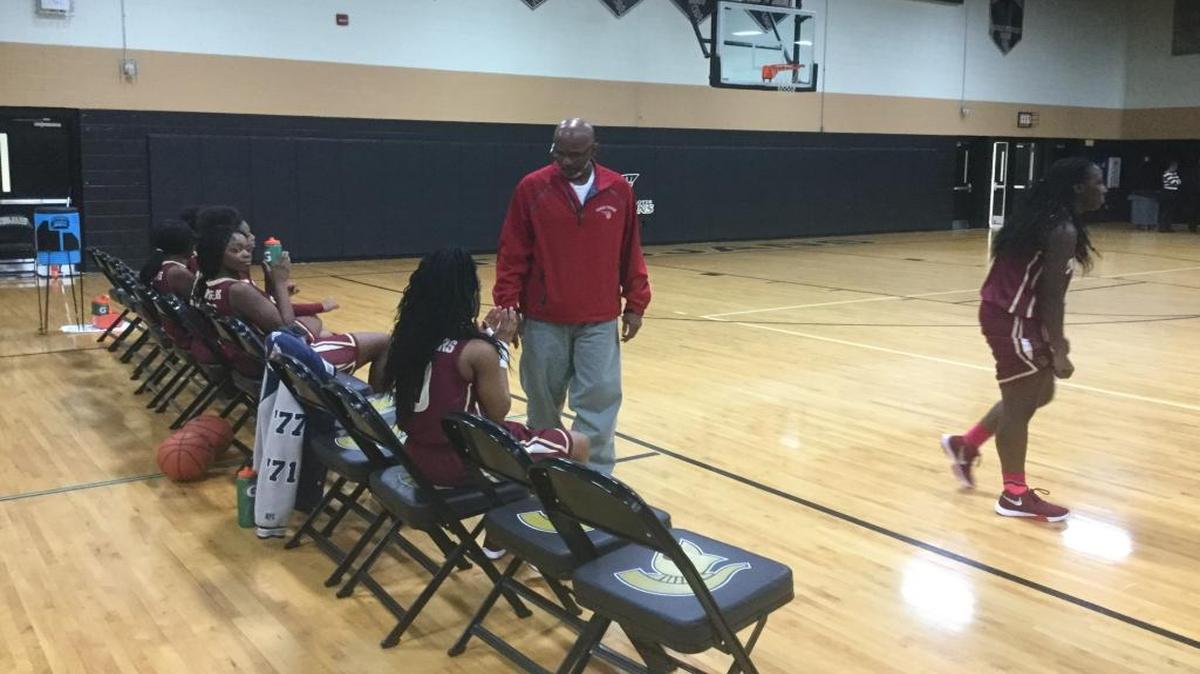 Carvers Bay coach Issiah Tucker looks at his bench as his team begins play after a timeout in the third quarter of Friday night’s win over Green Sea Floyds.