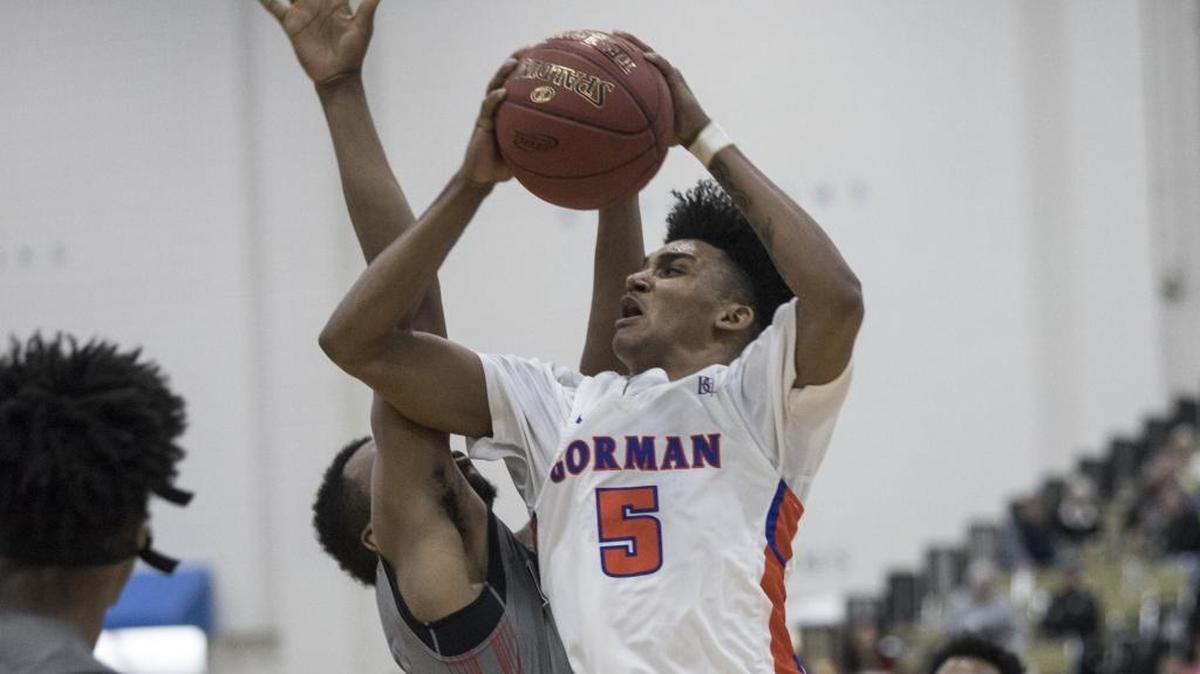 Jamal Bey of Las Vegas’ Bishop Gorman high school drives toward the basket over a defender from Imhotep Charter (Pa.) during Wednesday’s game.