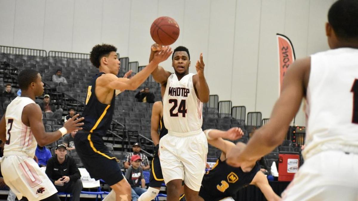 Imhotep's Donta Scott (24) passes to Dahmir Bishop (1) for the game-winning 3-pointer at the buzzer in the fifth-place game, a 47-44 Imhotep win.