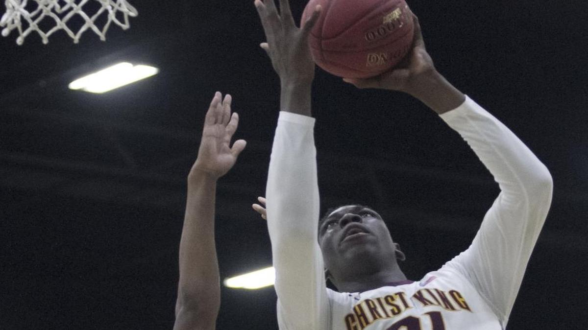 Christ the King’s Kofi Cockburn (right) had 14 points and seven rebounds in Saturday’s win over Providence.