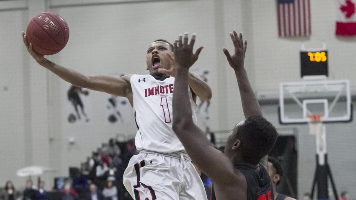 Imhotep’s Daron Russell goes up for a shot against Evanston Township in the championship game of the Beach Ball Classic.