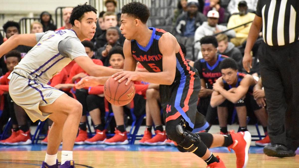 DeMatha’s (Md.) Justin Moore tries to get past Montverde Academy’s (Fla.) Andrew Nembhard during Friday night’s matchup at the Beach Ball Classic.