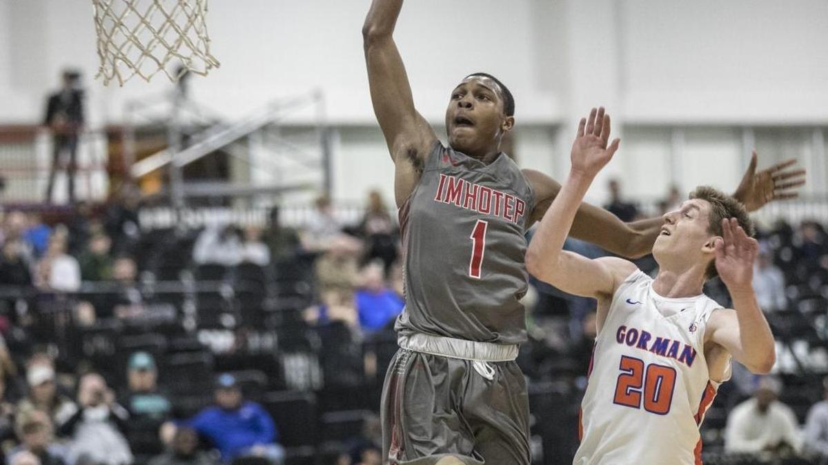 Imhotep Charter School’s Dahmir Bishop scores with a dunk against Bishop Gorman on Wednesday in the first round of the 37th Beach Ball Classic. The defending champions from Philadelphia defeated Bishop Gorman (Nev.) 53-49 and will face DeMatha Catholic (Md.) in Thursday’s quarterfinals.