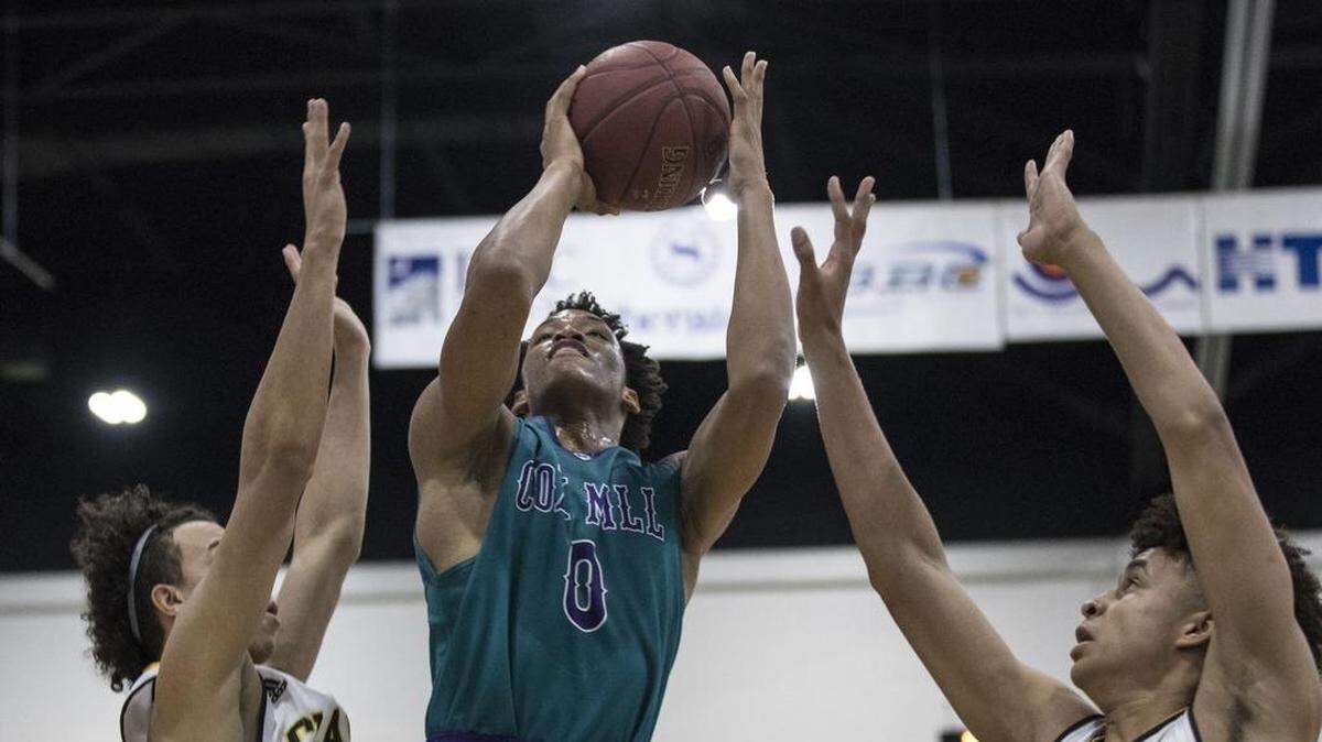 Wendell Moore, center, and Cox Mill will return to the Beach Ball Classic after placing fourth in 2017.