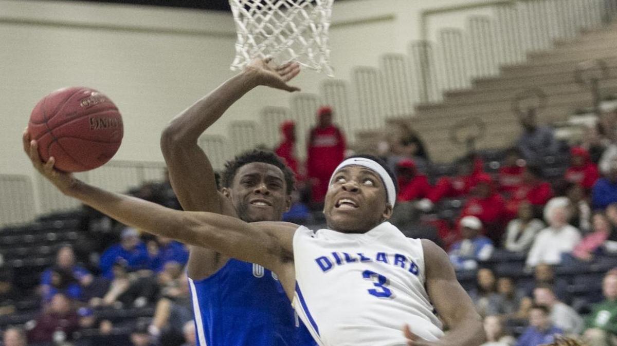 Dillard’s Bryce Oliver eludes the outstretched arms of a Bishop O’Connell defender en route to a lay-up during the Panthers’ 53-41 win Wednesday in Beach Ball Classic action.