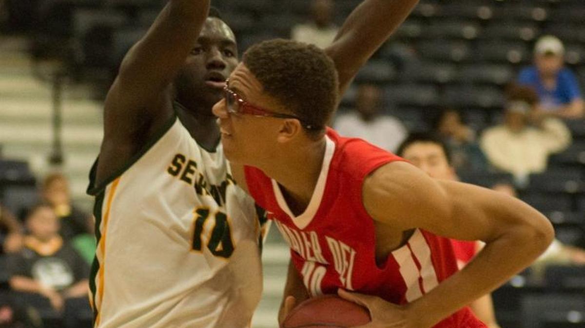 Mater Dei’s Miles Brookins (right) looks to shoot against Myrtle Beach’s JaQuan Chestnut.