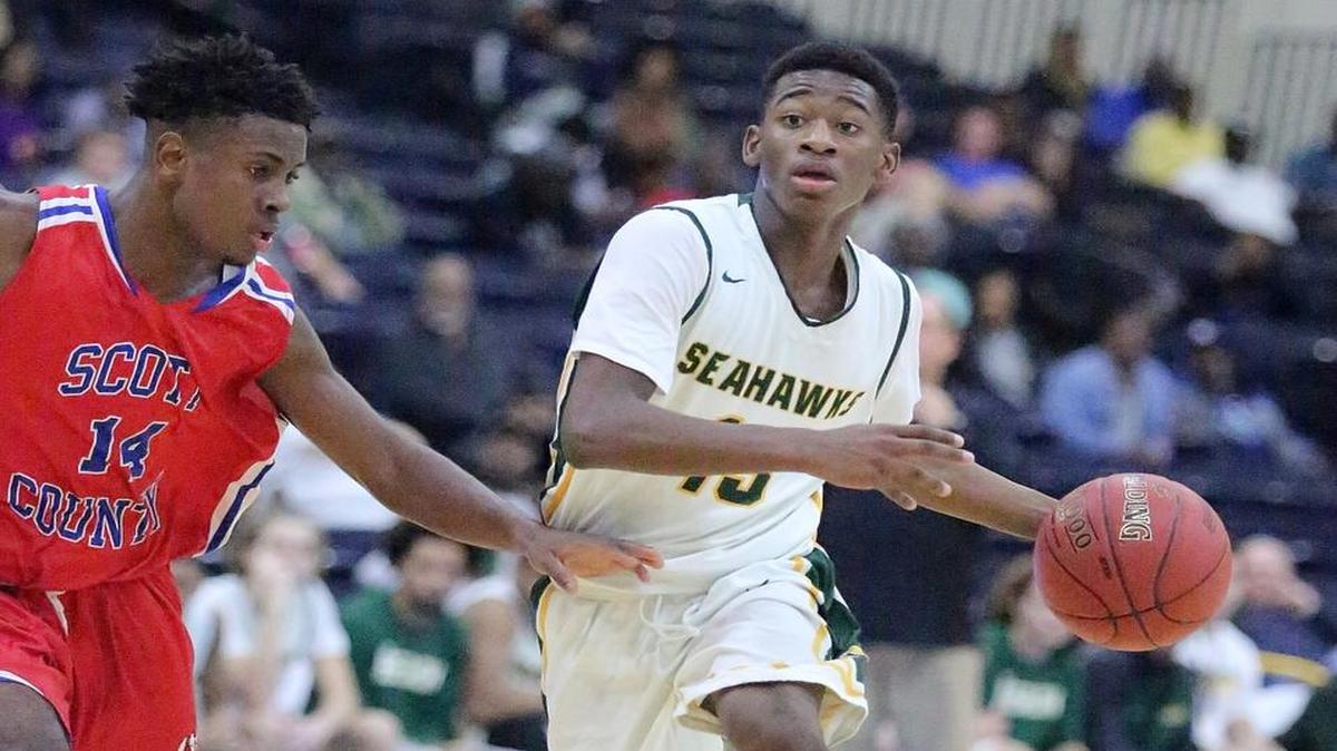 Emory Knox (13) of Myrtle Beach controls the ball in the game with Scott County, Ky.
