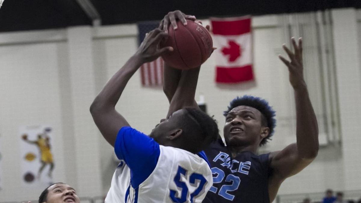Dillard’s Joniya Gadson is blocked by Pace’s Wendell Carter during the Beach Ball Classic’s third-place game.
