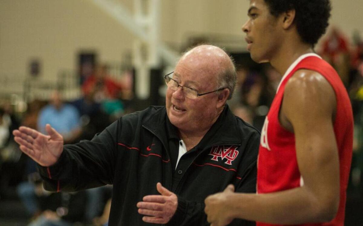 Mater Dei coach Gary McKnight, who is the winningest coach by percentage in high school history with a record of 1,024-90, preps his team during their game with Myrtle Beach on Monday.