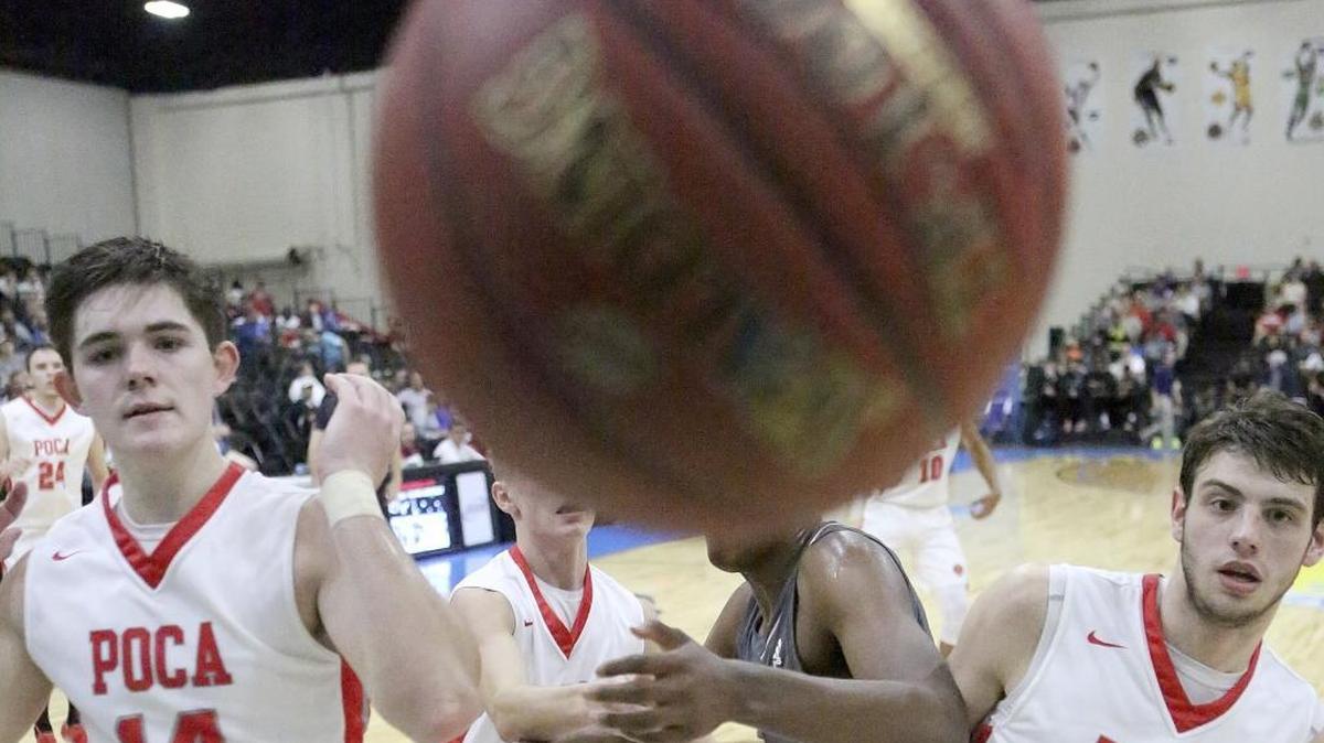 St. Francis and Poca players fight for control of a loose ball during their first-round game in the Beach Ball Classic game at the Myrtle Beach Convention Center.