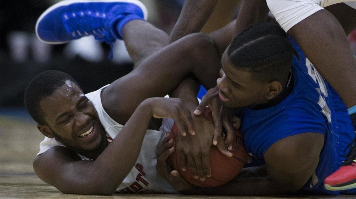 Imhotep’s Chereef Knox (left) and Dillard’s Joniya Gadson battle for a ball during the Beach Ball Classic.
