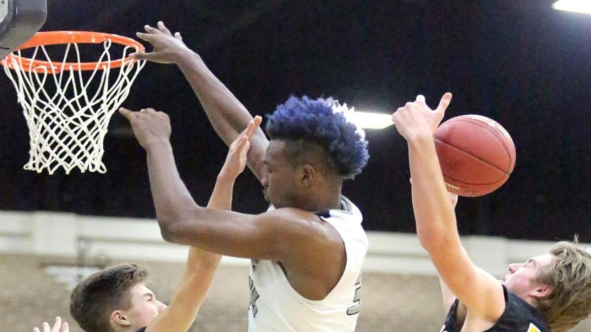 Wendell Carter of Pace (Ga.) is fouled during Monday’s game against McQuaid Jesuit (N.Y.).