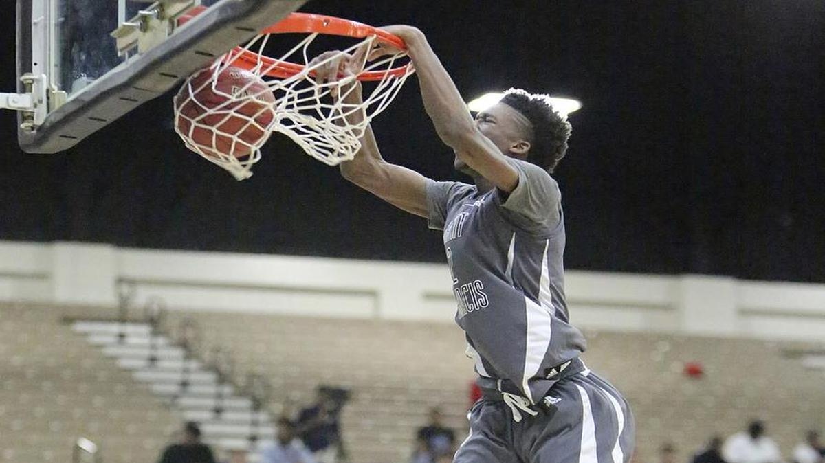 St. Francis’ Kobi Simmons throws down a dunk in Saturday’s game.