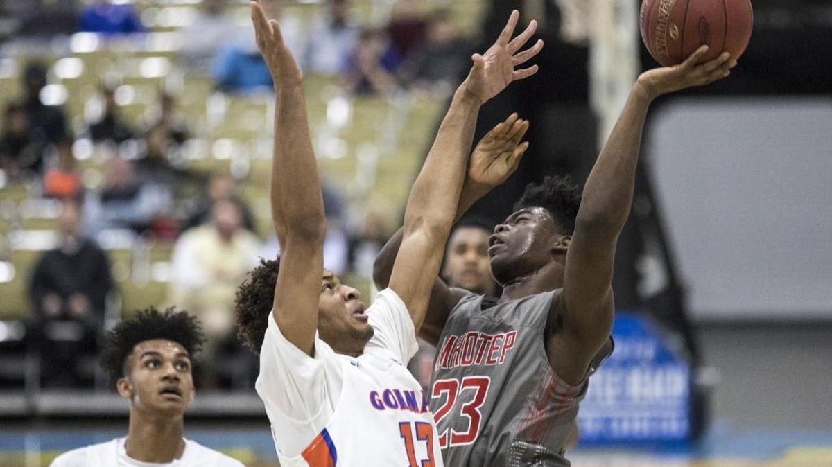 Imhotep Charter’s Jamil Riggins shoots over Bishop Gorman’s Zim Agu during Wednesday’s game in the Beach Ball Classic.