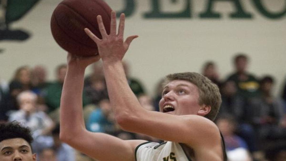 Myrtle Beach forward Ben Mintz (20) goes for a layout over the defender.
